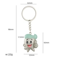 Cartoon tandsleutelhanger met mintgroene hoed en duim omhoog gebaar, 98mm lang - Cartoon Tand
