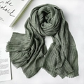 Green striped cotton linen scarf with elegant fringe trim on a white wooden surface - 1477 Modal Army Green