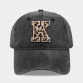 Detail of dark grey vintage baseball cap featuring a leopard print letter K embroidery - Letter K