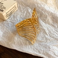 Elegant gold-plated open cuff bracelet featuring a multi-layered wavy fold design - Gold Multi-layer Hollow Wave Style
