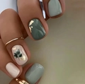 Short square press-on nails in sage green and cream with gold foil and leaf patterns - Yellow Jelly Glue + Nail File
