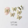 Detailed view of 12x11mm gold butterfly nail charm with white pearls and center rhinestone - Gold Artificial Pearl Butterfly Style (7181)