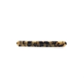 Detailed view of a slender tortoiseshell hair clip with smooth finish and spring clip mechanism - Beige Tortoise Shell