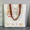 White canvas tote bag with brown straps featuring cute cartoon girl and rabbit illustration - Study Girl-EN