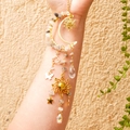 Detailed suncatcher view with natural crystal stones and celestial moon star pendants - Black Rutilated Quartz