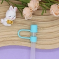 Light blue silicone straw cover cap for 10mm straws shown on a translucent straw - 10mm Straw Cap (Without Straw) / Cyan