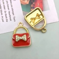 DIY red enamel handbag pendant with golden bow and rhinestones for jewelry making - 1pc Red Dotted Diamond Woman Bag