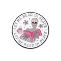 Enamel pin featuring a skeleton reading a pink book with Let Me Read In Peace text - Pink Book Reading Skeleton