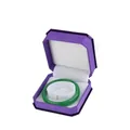 Green jade bangle displayed in a purple velvet jewelry box with white lining - Bracelet Box / Purple With White Interior