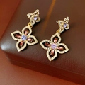 Macro detail of vintage gold floral earrings with purple and pink gemstones in a brown box - Purple Flower Earrings / 11# Silver Pin-Gold-Purple