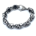 Detailed close-up of a silver punk skull bracelet link with a secure lobster clasp - Skull Eight / Silver