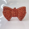 Elegant red rhinestone bow clutch bag with golden metal frame and luxury crystal finish - Red / Gold Hardware