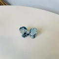 Detailed macro view of the marble blue acetate bow hair clip with sparkling rhinestones - Blue Green Floral Butterfly