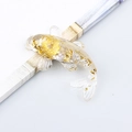 Resin koi fish figurine with embedded gold foil details and transparent finish - White Crystal