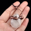 Vintage bronze teardrop necklace featuring a transparent crystal quartz pendant on a black cord - White Crystal