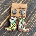 Detail of wooden western cowboy boot earrings with floral leather inlay on wood texture - Green White Floral Leather