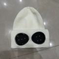Detail of white knitted beanie featuring integrated black goggles for winter sports - M (56-58cm) / Cream