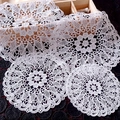 Close-up of white round lace coasters featuring intricate floral hollow embroidery detail - 15CM / Iris