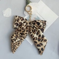 Portachiavi con fiocco in tessuto leopardato e anello in metallo dorato per borse - Leopardo Giallo