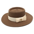 Close-up of dark brown straw boater hat featuring a cream ribbon and gold bee buckle - M (56-58cm) / Brown