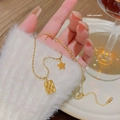 Elegant 18K gold-plated beaded necklace featuring star and textured square pendants - X100 Gold Checkerboard Star