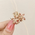 Pink crystal flower hair claw clip in gold finish for elegant side styling - Champagne