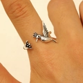 Detailed view of hummingbird and bud on a vintage adjustable silver metal ring - Hummingbird and Bud Style (10405)