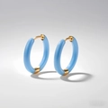Macro shot of light blue enamel hoop earrings with polished gold-plated buckle - Azure Blue