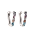 Macro shot of silver hoops featuring multi-colored cubic zirconia and turquoise inlay - Platinum Multi Zirconia