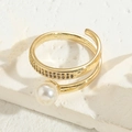 Golden spiral ring with white pearl and double-row zircon inlay on stone stand - Single Pearl Style