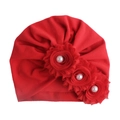 Detailed view of red infant turban hat with three fabric flowers and white pearls - Red