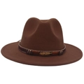 Detail of brown wool fedora featuring ethnic woven band and gold metal feather charm - Coffee