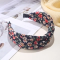 Dark blue fabric headband with colorful floral print and stylish twist knot detail - Floral Knot (FK-B178 Navy Blue)