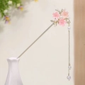 Detailed view of pink cherry blossom hair pin with white pearls and gold tassel charms - Small Pink Cherry Blossom