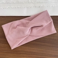 Soft pink ribbed knit sports headband featuring a twist knot design for women - Pink