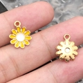 Daisy flower alloy pendants in yellow enamel and gold finish shown on finger - 1Pc Yellow Round Small Daisy 11.4x14.6mm