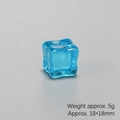 Macro shot of a 18x18mm blue translucent resin ice cube decor weighing 5g for DIY crafts - Transparent Blue