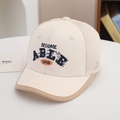 Detail of kids baseball cap featuring breathable mesh and 3D letter embroidery in cream - 54cm (3-8 Years) / ABLE-Rice White