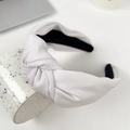 Minimalist white knotted fabric headband with black inner lining on ceramic bowl - White 17.5CM