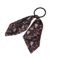 Close-up of Halloween hair scrunchie with pumpkin, ghost, and bat patterns on black ribbon - Black Pumpkin Ghost Style