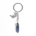 Blue hexagonal crystal point pendant keychain with silver moon and wing charm detail - Blue Sodalite