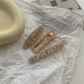 Detailed view of 3-piece leopard print hair clips with gold glitter and metal grip - Starry Sky 3Pcs Set - Gold
