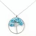 Detailed view of silver tree of life pendant with blue natural crystal stones on a chain - Blue Turquoise