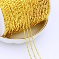 Detailed view of 18K gold plated copper beaded chain wrapped on a white spool for DIY jewelry - 1.5mm Bamboo Chain 1:1 / Thick Silver
