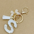 Letter S keychain with white marble resin, tassel and gold butterfly charm accessories - Letter S