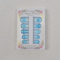 Detailed view of blue almond press-on nails with 3D bows, glitter, and pearl accents - Aqua Blue Bow (WY004)