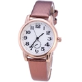 Detail view of white watch face with black numerals and a rose gold bezel on brown leather strap - Coffee