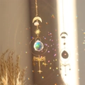 Golden suncatcher featuring a brass dragonfly, pink quartz stone and multifaceted crystal ball - Dragonfly Star