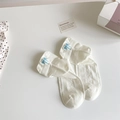 Chaussettes en coton blanc avec nœud brodé bleu clair et motif papillon ajouré - Taille unique / Blanc Cassé