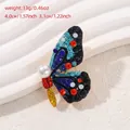 Golden butterfly brooch featuring colorful rhinestones and a large white pearl center - Five-Color Rhinestone Butterfly (KC0248)